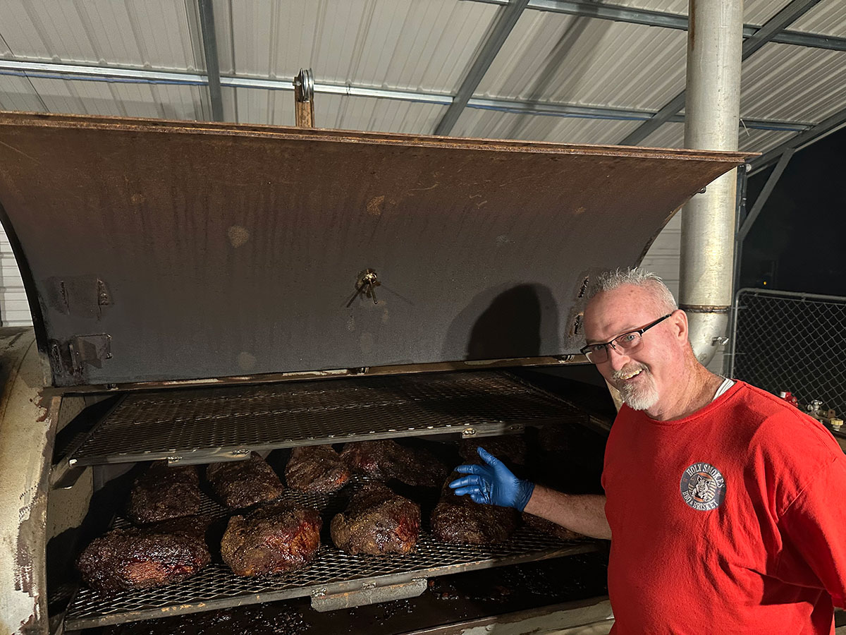 Slow-smoked beef brisket resting on the smoker